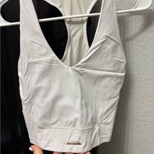 Gymshark White Tank Top with Fitted Design and Deep V-Neckline